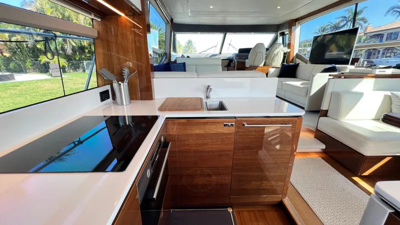 Slide: The Image of Luxurious 2019 Princess F62 yacht interior with modern kitchen and spacious seating area. - 6