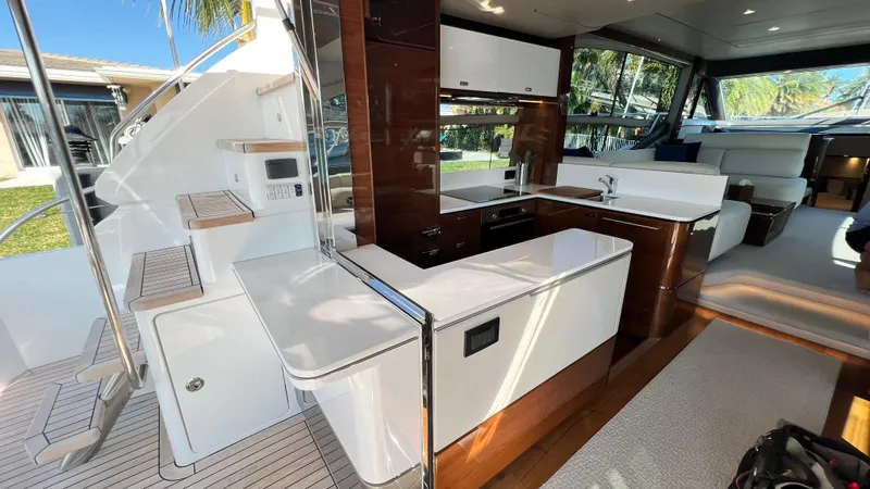 Slide: The Image of Luxurious interior of 2019 Princess F62 yacht with modern kitchen and seating area. - 7
