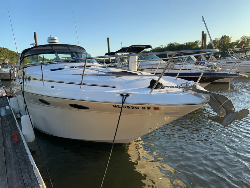 Slide: The Image of 1997 Sea Ray 370 Sundancer docked at a marina. - 2