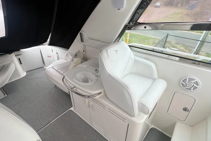 Slide: The Image of Interior of 1997 Sea Ray 370 Sundancer with white seating and sink. - 21