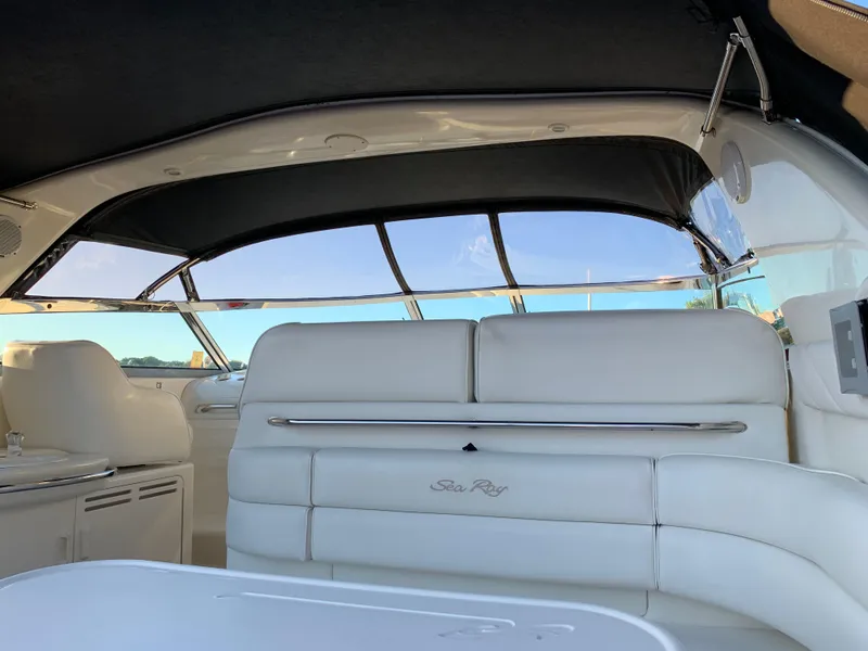 Slide: The Image of Interior of 1997 Sea Ray 370 Sundancer with white leather seating and panoramic windows. - 22
