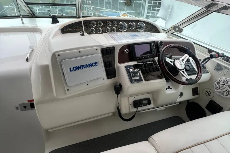 Slide: The Image of 1997 Sea Ray 370 Sundancer helm with Lowrance navigation system. - 32