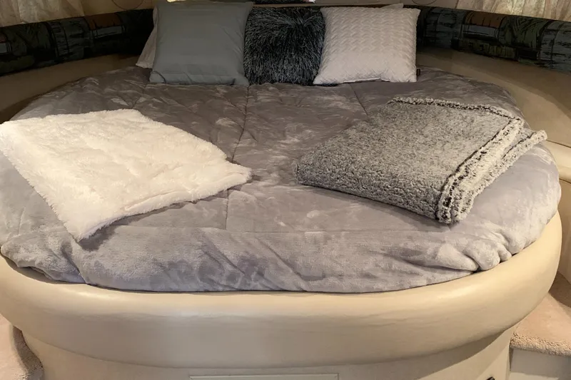 Slide: The Image of Luxurious bed in the 1997 Sea Ray 370 Sundancer yacht cabin. - 45