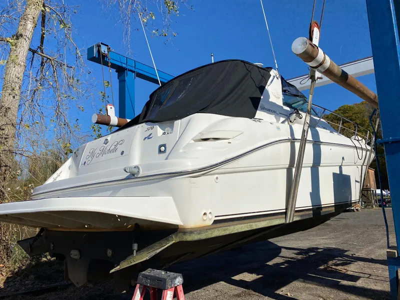 Slide: The Image of 1997 Sea Ray 370 Sundancer boat on a lift for maintenance. - 9