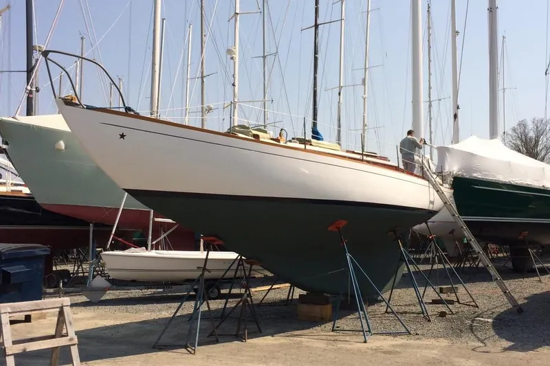 Slide: The Image of 1955 Concordia Yawl (Hull #33) sailboat on stands in a boatyard. - 36