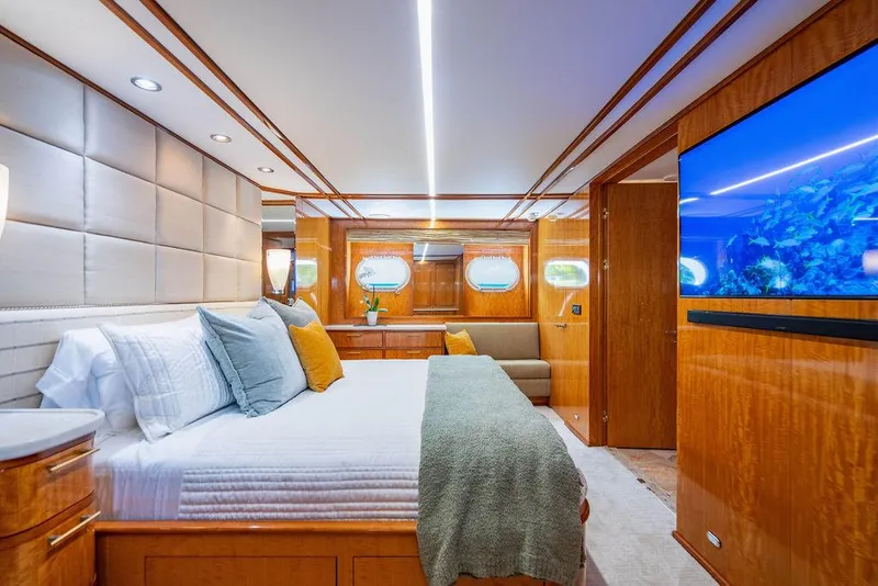 Slide: The Image of Luxurious 2001 Intermarine Raised Pilothouse yacht interior with wooden finishes and carpeted stairs. - 11