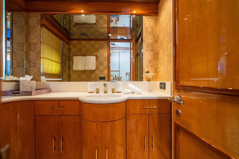 Slide: The Image of Luxurious bathroom in 2001 Intermarine Raised Pilothouse yacht with glass shower and wooden cabinetry. - 18