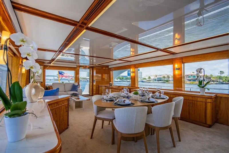 Slide: The Image of Outdoor deck of a 2001 Intermarine Raised Pilothouse yacht with seating and American flag. - 4