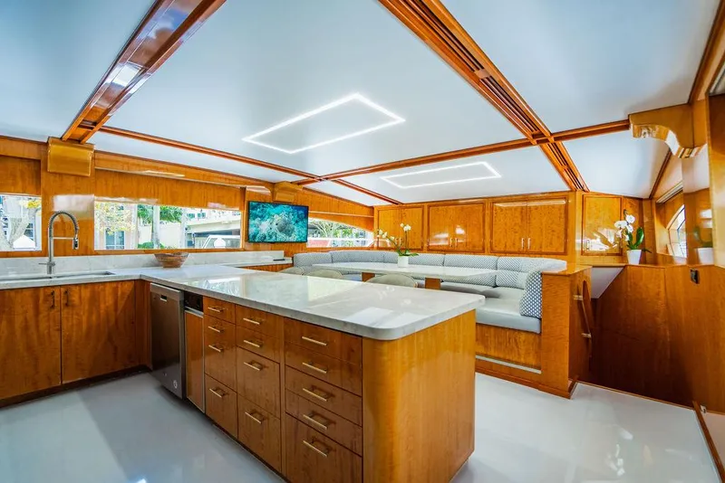 Slide: The Image of Luxurious dining area on a 2001 Intermarine Raised Pilothouse yacht with waterfront views. - 7