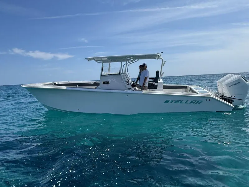 Slide: The Image of 2024 Custom 335 boat on clear blue ocean water - 11