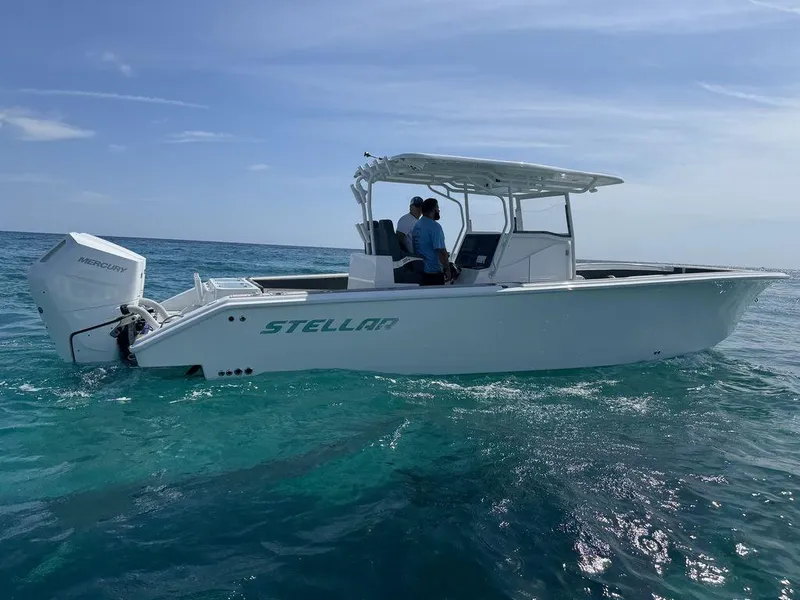 Slide: The Image of Custom 2024 model 335 boat named Stellar on clear blue ocean water. - 4