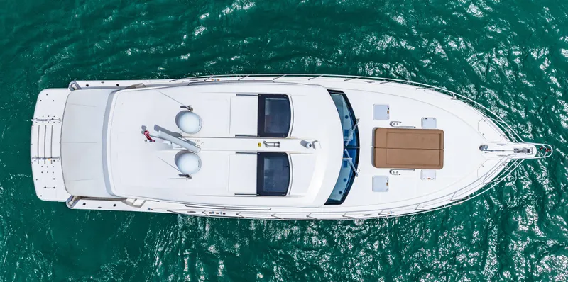 Slide: The Image of Aerial view of a 2017 Riviera 575 SUV yacht on the water. - 2