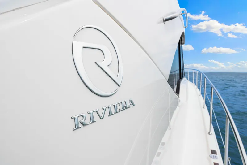 Slide: The Image of 2017 Riviera 575 SUV yacht on open water, side view with logo. - 21