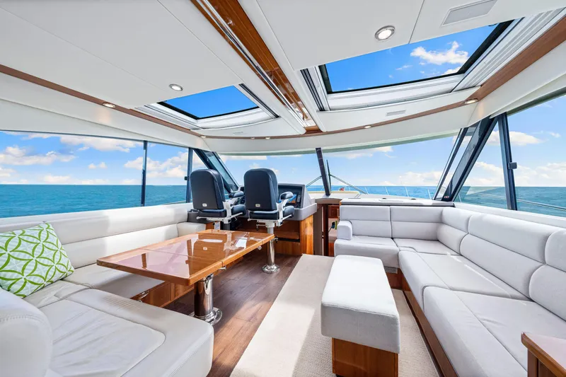 Slide: The Image of Luxurious interior of 2017 Riviera 575 SUV yacht with panoramic ocean views. - 28