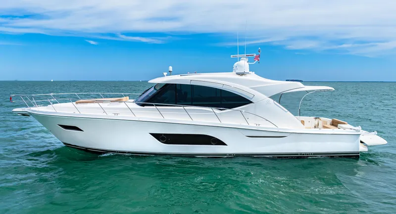 Slide: The Image of 2017 Riviera 575 SUV luxury yacht cruising on open water. - 3