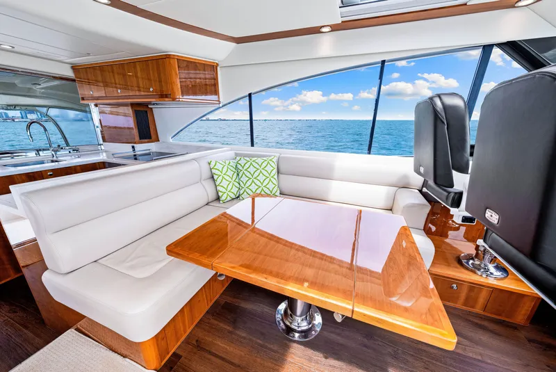 Slide: The Image of Luxurious interior of 2017 Riviera 575 SUV yacht with ocean view. - 30