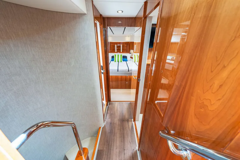 Slide: The Image of Interior hallway of 2017 Riviera 575 SUV yacht leading to bedroom. - 38