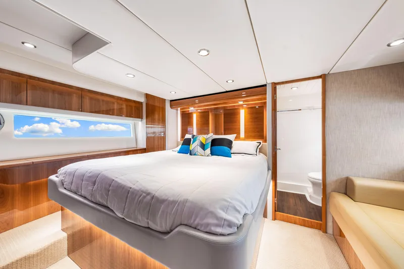Slide: The Image of Luxurious bedroom interior of 2017 Riviera 575 SUV yacht with modern design and ample natural light. - 40