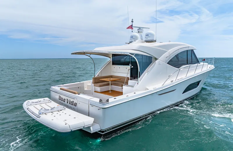 Slide: The Image of 2017 Riviera 575 SUV yacht cruising on open water. - 6