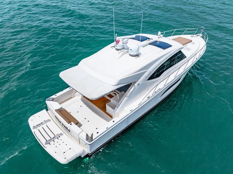 Slide: The Image of 2017 Riviera 575 SUV yacht cruising on clear blue waters. - 7