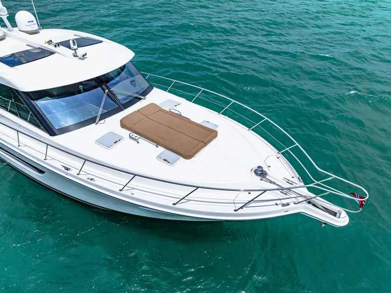 Slide: The Image of 2017 Riviera 575 SUV yacht cruising on clear blue water. - 8