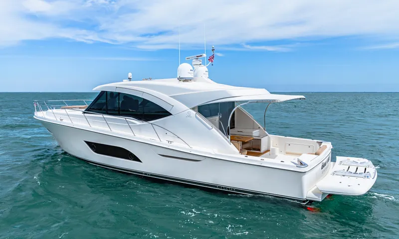 Slide: The Image of 2017 Riviera 575 SUV yacht cruising on open water. - 9