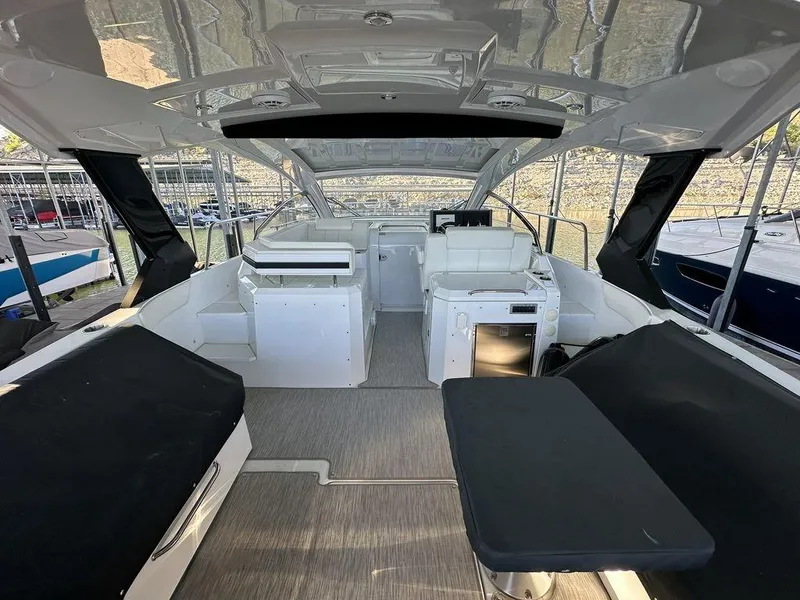 Slide: The Image of 2021 Cruisers Yachts 39 Express Coupe with advanced audio system under covered dock. - 11