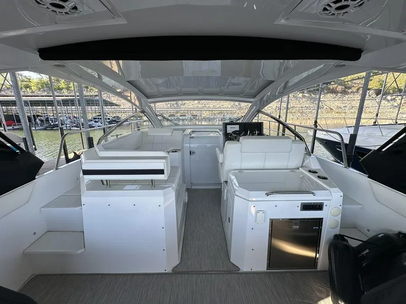 Slide: The Image of 2021 Cruisers Yachts 39 Express Coupe interior with helm and seating area. - 13