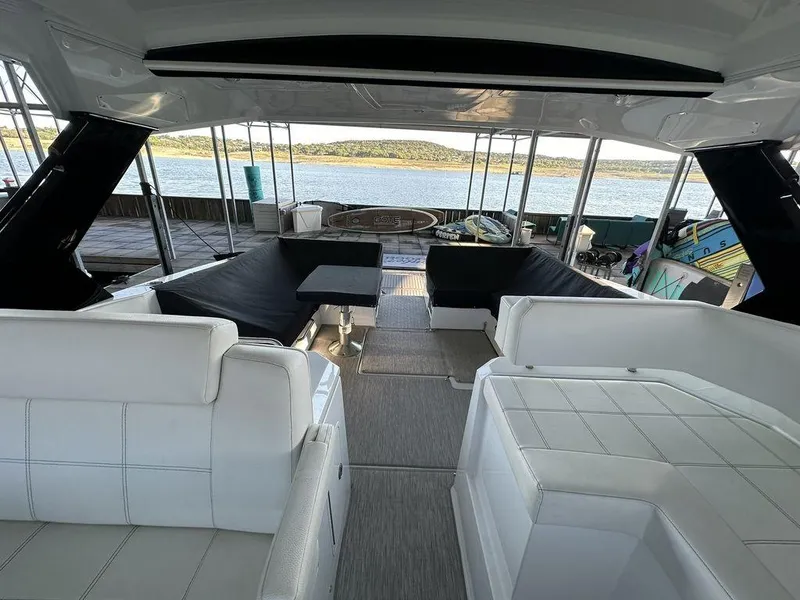 Slide: The Image of 2021 Cruisers Yachts 39 Express Coupe interior with lake view. - 16