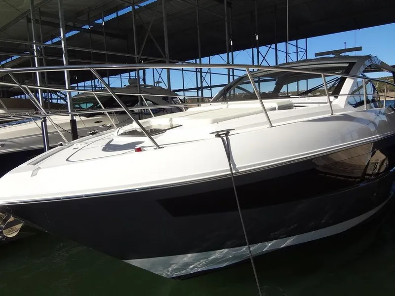 Slide: The Image of 2021 Cruisers Yachts 39 Express Coupe, side view in marina setting. - 22