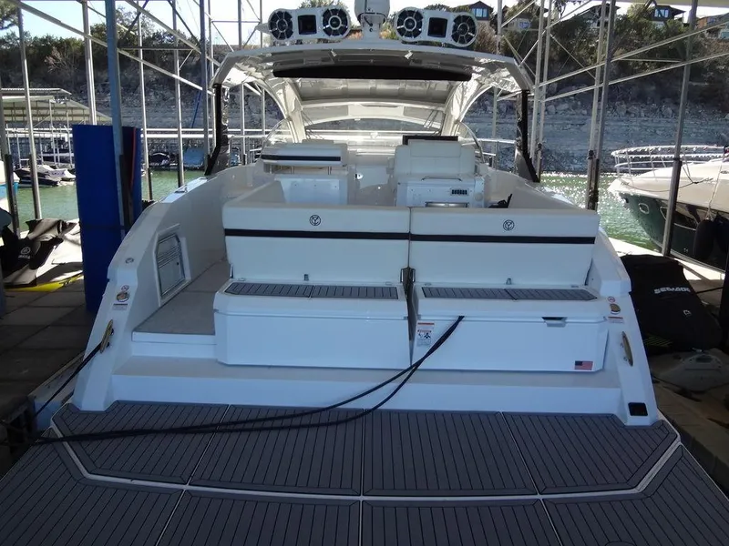 Slide: The Image of 2021 Cruisers Yachts 39 Express Coupe, rear seating area with sleek design. - 24