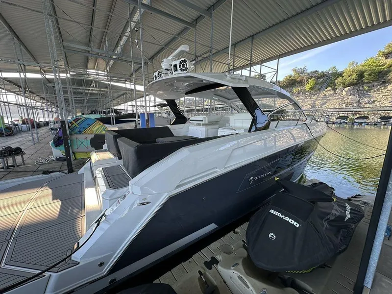 Slide: The Image of 2021 Cruisers Yachts 39 Express Coupe docked in a marina. - 3