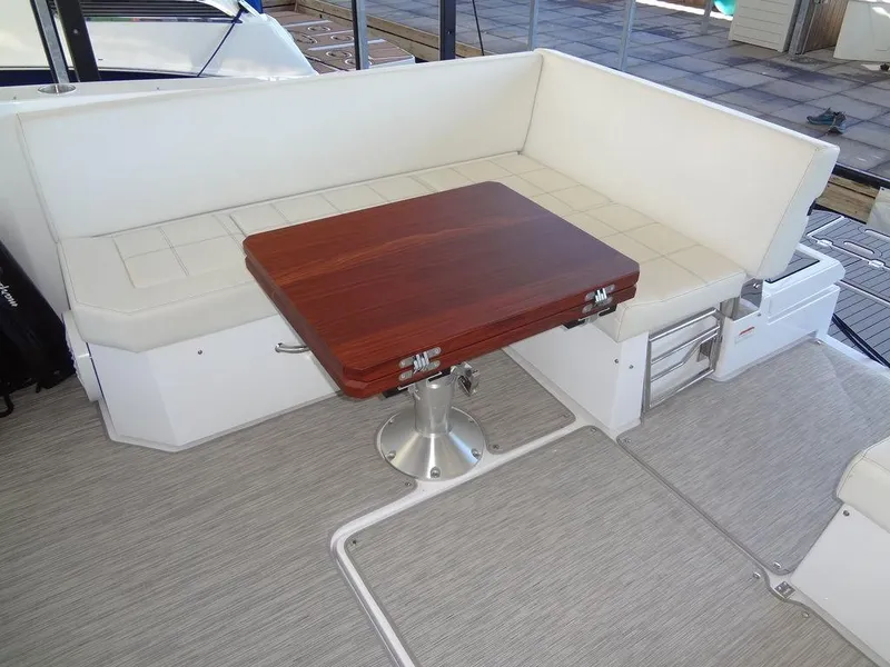 Slide: The Image of 2021 Cruisers Yachts 39 Express Coupe interior seating with modern design and sleek flooring. - 33