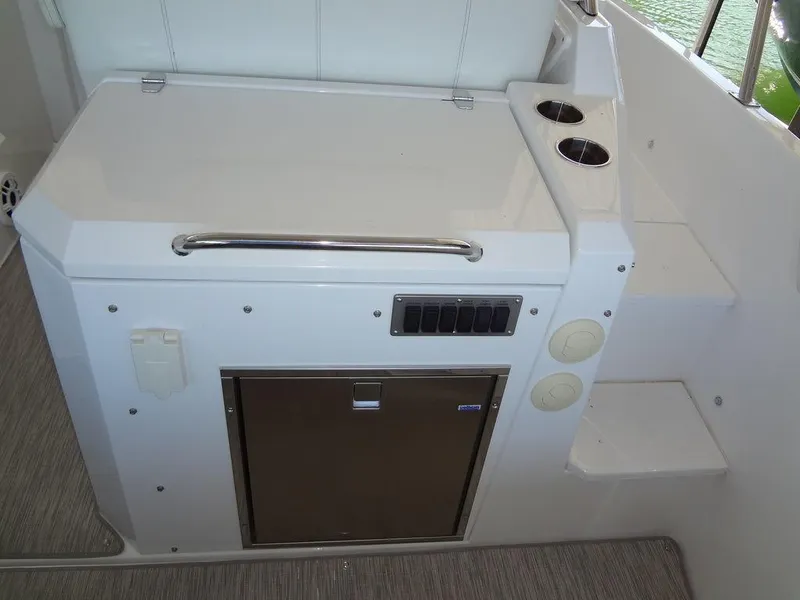 Slide: The Image of 2021 Cruisers Yachts 39 Express Coupe, sleek countertop with stainless steel accents. - 35