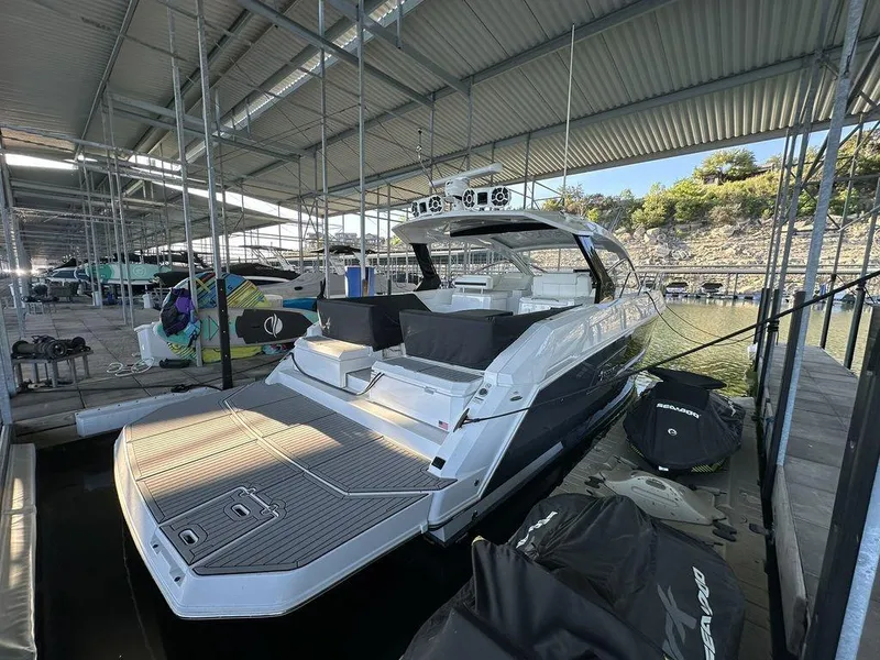 Slide: The Image of 2021 Cruisers Yachts 39 Express Coupe docked in a marina. - 4