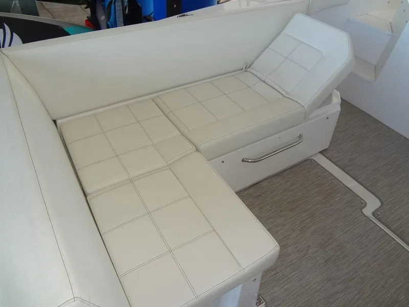 Slide: The Image of 2021 Cruisers Yachts 39 Express Coupe with sunpad on deck, docked in sunlight. - 47