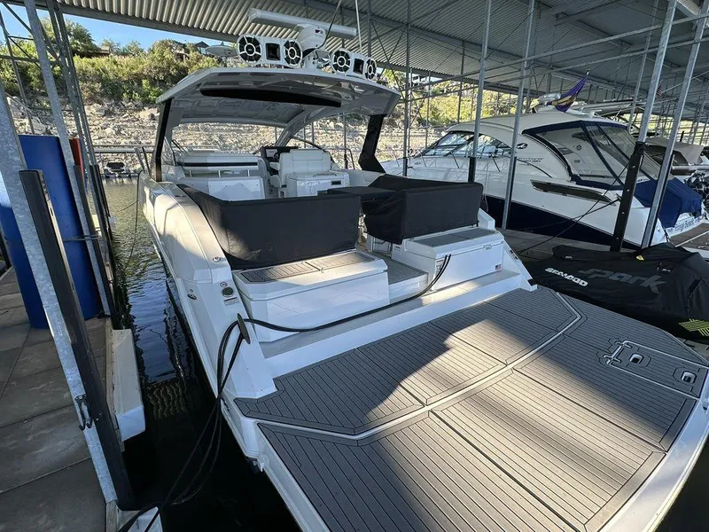 Slide: The Image of 2021 Cruisers Yachts 39 Express Coupe docked in a marina. - 5
