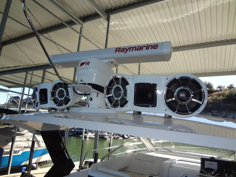 Slide: The Image of Luxurious interior of 2021 Cruisers Yachts 39 Express Coupe with elegant seating and striped cushions. - 56