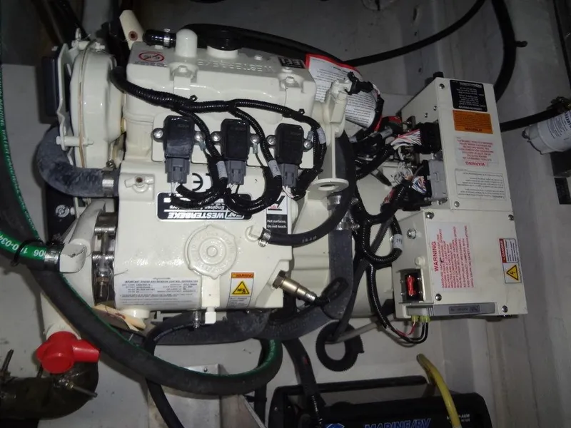 Slide: The Image of 2021 Cruisers Yachts 39 Express Coupe interior with elegant wood cabinets and comfortable seating. - 59