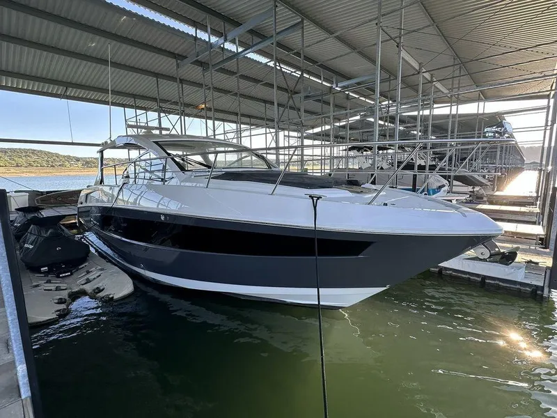 The Image of 2021 Cruisers Yachts 39 Express Coupe docked in a marina. - 0