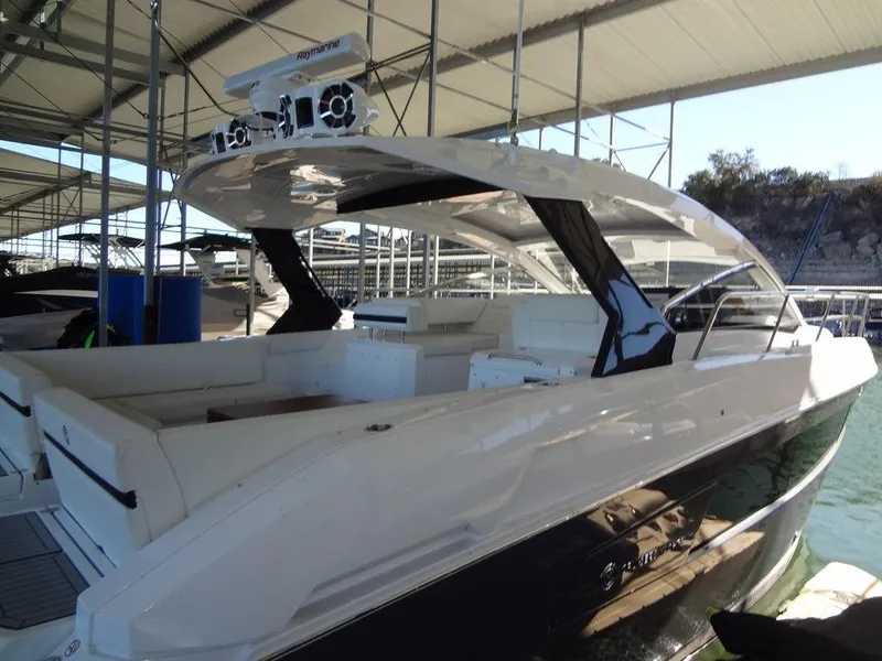 Slide: The Image of 2021 Cruisers Yachts 39 Express Coupe docked in marina. - 19