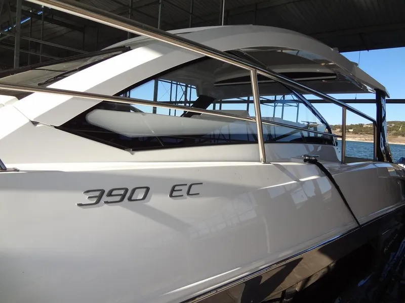 Slide: The Image of 2021 Cruisers Yachts 39 Express Coupe docked, showcasing spacious rear deck and seating area. - 23