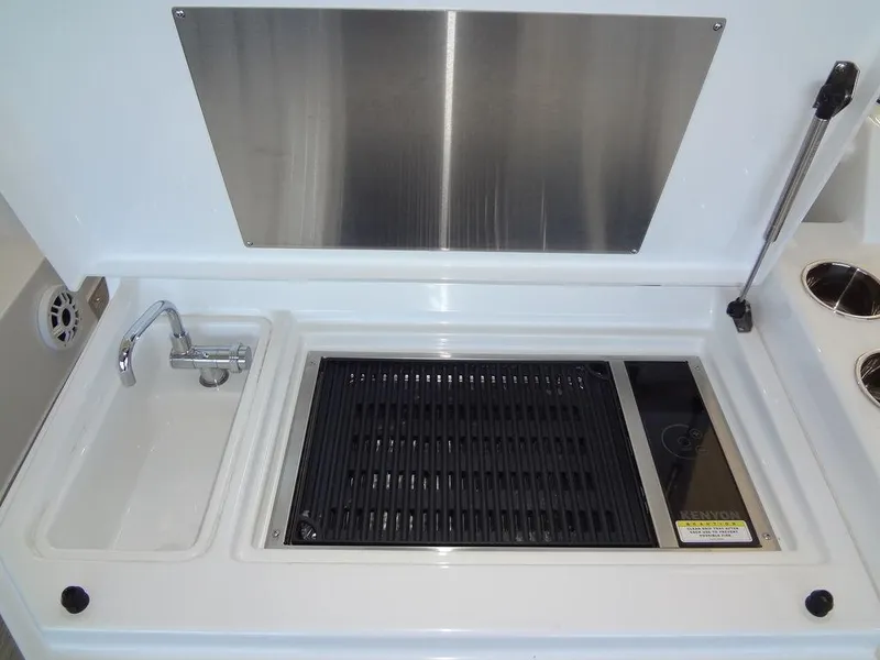 Slide: The Image of 2021 Cruisers Yachts 39 Express Coupe interior with control panel and stainless steel hatch. - 37