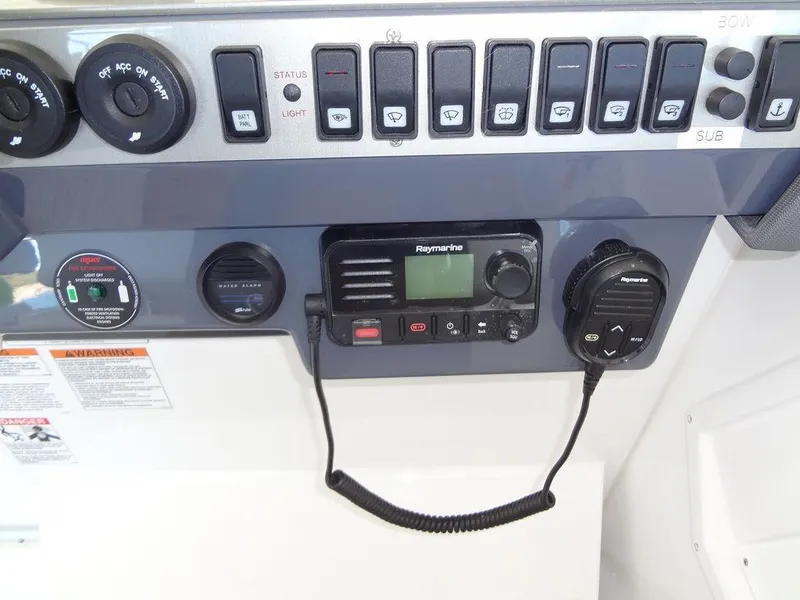 Slide: The Image of Luxurious seating area on 2021 Cruisers Yachts 39 Express Coupe with wooden table. - 45