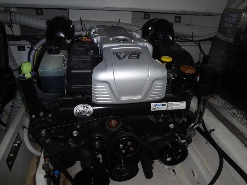 Slide: The Image of Luxurious interior of 2021 Cruisers Yachts 39 Express Coupe with striped cushions and wooden table. - 57