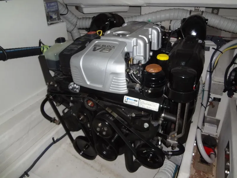 Slide: The Image of Interior of 2021 Cruisers Yachts 39 Express Coupe with modern seating and striped pillows. - 58