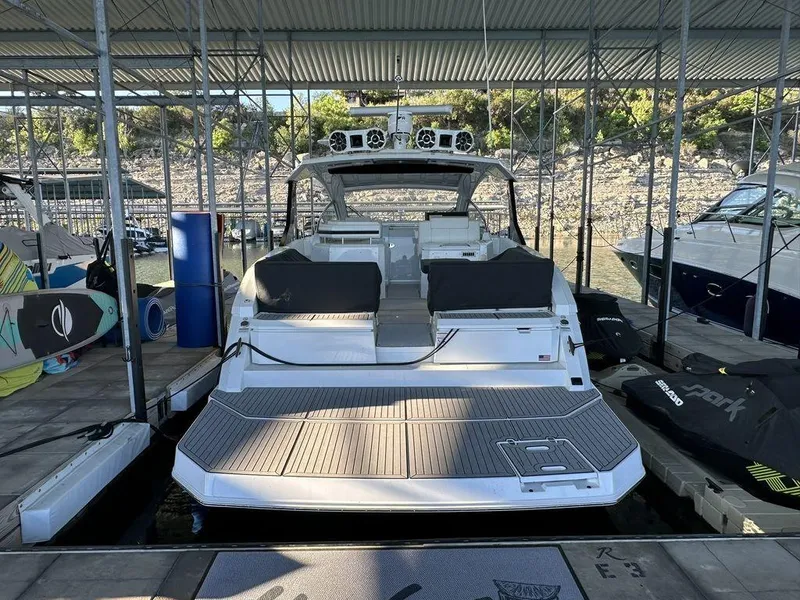 Slide: The Image of 2021 Cruisers Yachts 39 Express Coupe docked in a marina. - 6