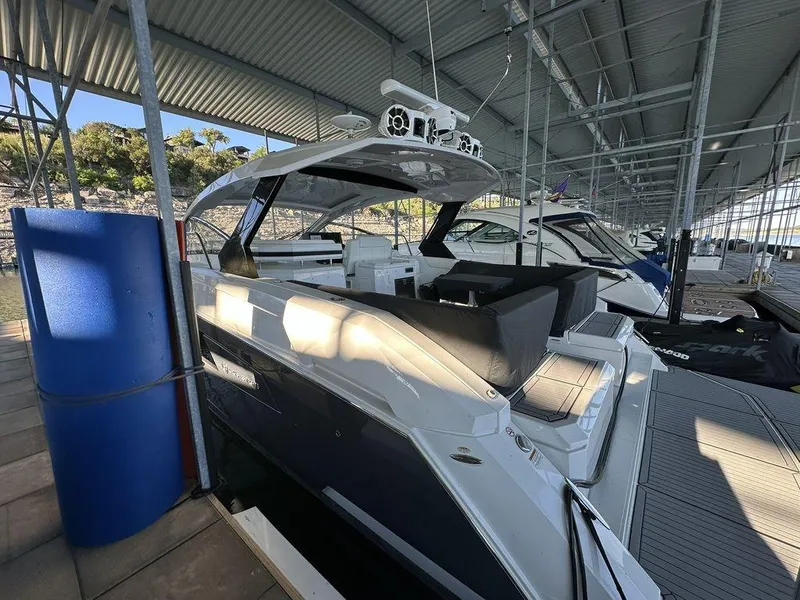 Slide: The Image of 2021 Cruisers Yachts 39 Express Coupe docked in a marina. - 7