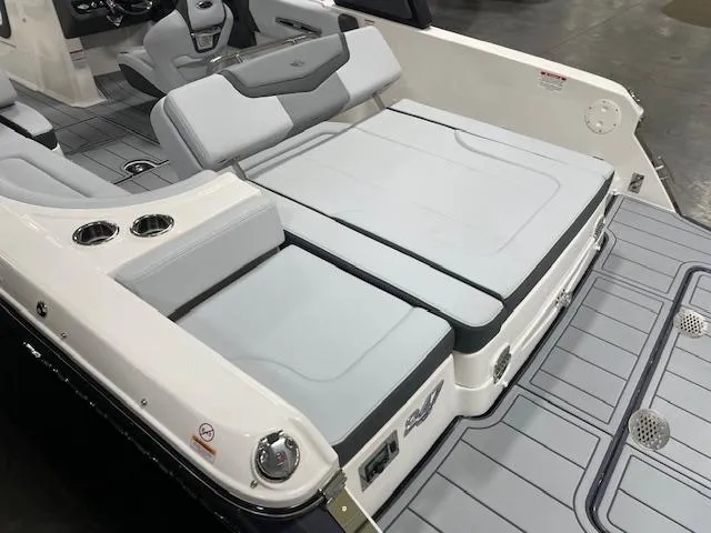 Slide: The Image of 2025 Chaparral 247 SSX boat interior with gray seating and cup holders. - 3