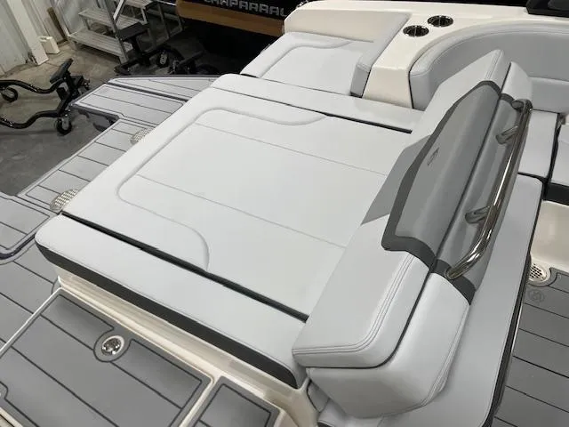 Slide: The Image of 2025 Chaparral 247 SSX boat with sleek white seating and modern design. - 4